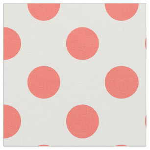Living coral polka dots on white fabric