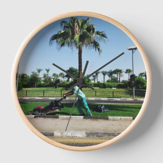 Local resident is engaged in landscaping in Egypt Clock