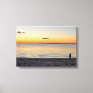 Lone Figure Standing on Beach Canvas Print