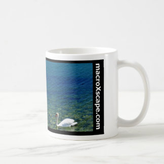 lone swan in blue ocean coffee mug