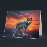 Lone Wolf at Sunset Card<br><div class="desc">A stunning artwork of a lone wolf standing majestically on a cliff during a blazing sunset. This design captures the essence of independence, strength, and serenity – perfect for those who walk their own path</div>