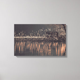 Lonely bench by the lake in the golden light canvas print