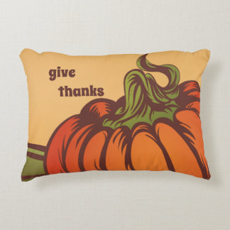 Lonely pumpkin one the field. Autumn leaves fall. Accent Pillow