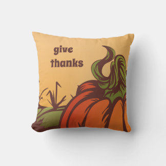 Lonely pumpkin one the field. Autumn leaves fall. Throw Pillow