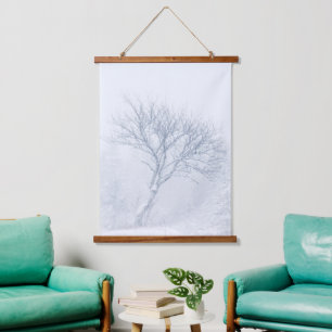 Lonely tree during snow storm in winter hanging tapestry