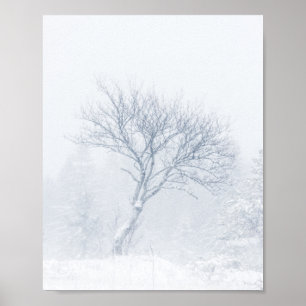 Lonely tree during snow storm in winter poster