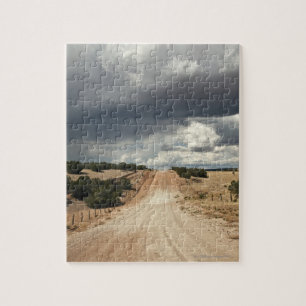 Looking down a  dirt country road in NM with Jigsaw Puzzle