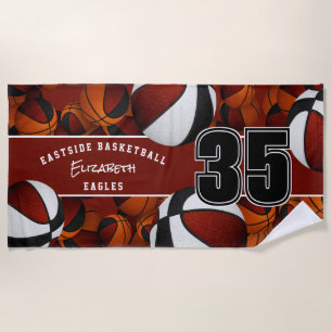 Lots of basketballs maroon black team colours beach towel