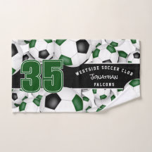 Lots of green black team colours soccer balls 