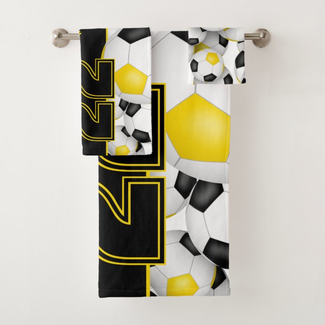 Lots of soccer balls custom team name black gold bath towel set (Insitu)
