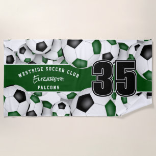 Lots of soccer balls with green black team colours beach towel