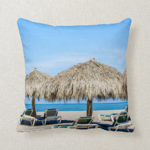 Lounge Chairs And Thatch Umbrellas On Beach Throw Pillow