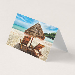 Lounge chairs on beach throw pillow