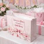 Love is in Bloom pink bow floral Bridal Shower Large Gift Bag<br><div class="desc">Blush pink background decorated with a pink coloured bow and pink roses,  flowers. Personalize and add a name
Text: Love is in Bloom</div>