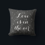 Love is in the Air Cushion<br><div class="desc">Delicate floating seeds and ribbon script on a soft chalkboard background accent this cushion. Love is in the air,  reminds us of dandelion wishes,  and romantic dreams,  making it perfect for the newlyweds or wedding sweetheart table. Scroll down to see other coordinating cushions.</div>