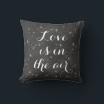 Love is in the Air Cushion<br><div class="desc">Delicate floating seeds and ribbon script on a soft chalkboard background accent this cushion. Love is in the air, reminds us of dandelion wishes, and romantic dreams, making it perfect for the newlyweds or wedding sweetheart table. Scroll down to see other coordinating cushions.</div>