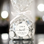 Love Is Sweet Cream Wedding Favour Classic Round Sticker<br><div class="desc">Chic light cream sticker for your wedding reception desserts and candy favours with "Love Is Sweet" in simple modern typography and an elegant script with swashes,  your first names joined together by a heart and your wedding date.</div>