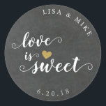 Love is Sweet Custom Wedding Favour Chalkboard Classic Round Sticker<br><div class="desc">Custom-designed wedding candy buffet favour stickers featuring gold glitter heart and "Love is Sweet" in elegant hand brushed script/calligraphy on a vintage rustic chalkboard background. Personalize this wedding favour sticker with bride and groom's names and wedding date for a touch of style to your wedding favours and gifts.</div>