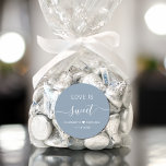 Love Is Sweet Dusty Blue Wedding Favour Classic Round Sticker<br><div class="desc">Chic dusty blue sticker for your wedding reception favours featuring "Love Is Sweet" in simple modern white typography and an elegant white script with swashes,  your first names joined together by a heart and your wedding date.</div>