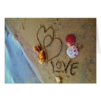 Love on beach w/ hearts