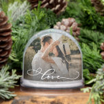 Love Simple Modern Script 2 Photo Snowglobe<br><div class="desc">This custom romantic photo snow globe with the word "Love" is a heartfelt gift choice for anniversaries, Valentine's Day, weddings, or just because. The elegant snow globe showcases a single custom photo with a graceful calligraphy-style "love" script across the photo, adding a tender and stylish touch. Designed to highlight your...</div>