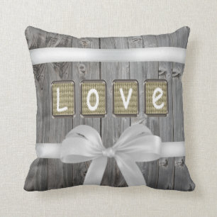 LOVE stitched on old light brown fabric Throw Pillow