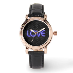 LOVE text in neon lighting on brick Watch