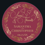 Love & Thanks Elegant Burgundy & Gold Wedding Classic Round Sticker<br><div class="desc">These beautiful burgundy and gold stickers are designed to use as wedding favour tags, or as envelope seals for your wedding thank you cards. The elegant design features an ornate lacy golden border with fancy script lettering reading "Love & Thanks!" There are romantic hearts scattered about with room for the...</div>