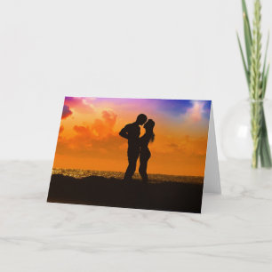 Lovers Kissing at Sunset on the Beach Card