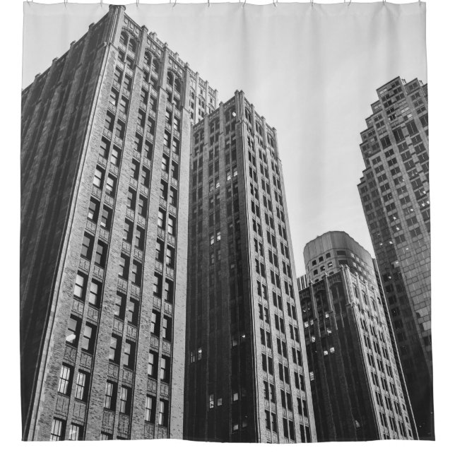 LOW ANGLE GRAYSCALE PHOTOGRAPHY OF HIGH-RISE BUILD (Front)