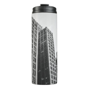 LOW ANGLE GRAYSCALE PHOTOGRAPHY OF HIGH-RISE BUILD THERMAL TUMBLER
