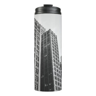 LOW ANGLE GRAYSCALE PHOTOGRAPHY OF HIGH-RISE BUILD THERMAL TUMBLER