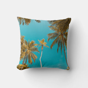 Low-angle photo of coconut trees throw pillow
