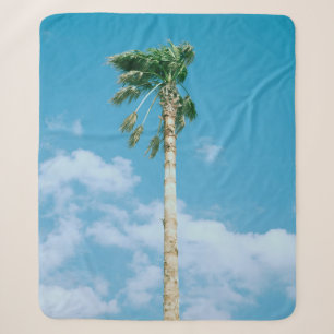 Low-angle photo of palm trees under blue sky sherpa blanket