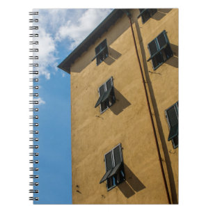 LOW ANGLE PHOTOGRAPHY OF BROWN LOUVER WINDOW NOTEBOOK