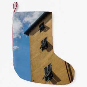 LOW ANGLE PHOTOGRAPHY OF BROWN LOUVER WINDOW SMALL CHRISTMAS STOCKING