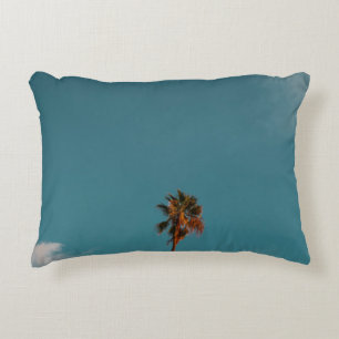 Low angle photography of palm tree under blue sky accent pillow
