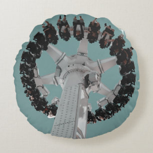 Low-angle photography of people riding a drop-down round pillow