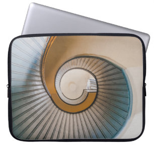 Low angle photography of spiral ladder laptop sleeve