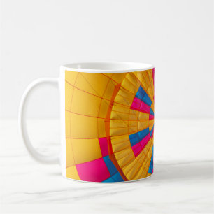 Low angle photography of yellow, pink, and black h coffee mug