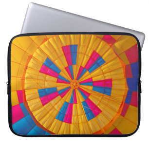 Low angle photography of yellow, pink, and black h laptop sleeve