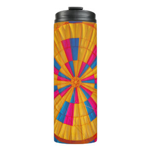 Low angle photography of yellow, pink, and black h thermal tumbler