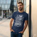 Low Effort Still Winning Funny Meme Shirt<br><div class="desc">Not loud. Not stressed. Still winning. This design captures a quiet kind of confidence—the kind that doesn’t chase attention but gets results anyway. It’s a little sarcastic, a little honest, and very relatable for anyone tired of the “always hustle” mindset. Perfect for people who move smart, keep it simple, and...</div>