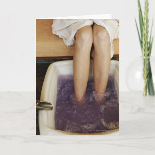 Low section view of a woman getting a pedicure card