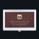 Luxury Gold Initial Logo Oxblood Leather Business Card Holder<br><div class="desc">Simple modern luxury design with brushed metallic gold initial logo medallion with personalized name,  title,  company name or custom text below in classic block typography on a oxblood red leather textured background. Personalize for your custom use.</div>