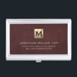 Luxury Gold Initial Logo Oxblood Leather Business Card Holder<br><div class="desc">Simple modern luxury design with brushed metallic gold initial logo medallion with personalized name,  title,  company name or custom text below in classic block typography on a oxblood red leather textured background. Personalize for your custom use.</div>