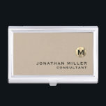 Luxury Gold Monogram Beige Business Card Holder<br><div class="desc">Simple modern design with luxury brushed metallic gold monogram medallion with personalized name and title or custom text below in classic block typography on a solid beige background. Personalize for your custom use.</div>