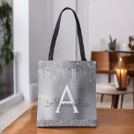 Luxury Silver Glitter Sparkle Elegant Monogram Tote Bag<br><div class="desc">Luxury Silver Faux Sparkle and Dripping Glitter Metallic Stainless Steel Foil Elegant Monogram Book Bag. This Book Bag can be customized to include your initial and first name and given as a gift for Christmas,  Sweet 16,  18th,  21st,  30th,  40th,  50th,  or 60th Birthday,  Bridal Shower or a Wedding.</div>