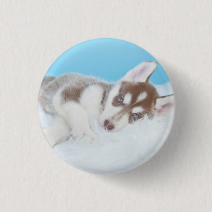 Macaron Rond 2,50 Cm Petite marionnette Husky posée sur une couverture