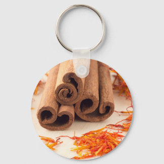 Macro view of the sticks of cinnamon and saffron keychain